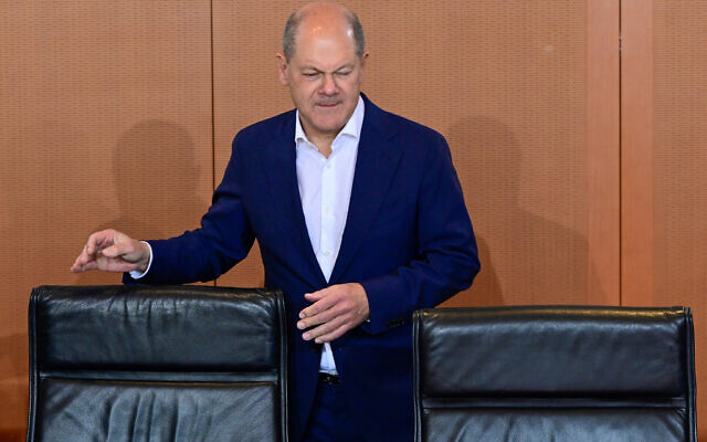 German Chancellor Olaf Scholz takes his seat to chair a meeting of the security cabinet at the Chancellery in Berlin on October 18, 2023. (John MACDOUGALL / AFP) German Chancellor Olaf Scholz takes his seat to chair a meeting of the security cabinet at the Chancellery in Berlin on October 18, 2023. (John MACDOUGALL / AFP)