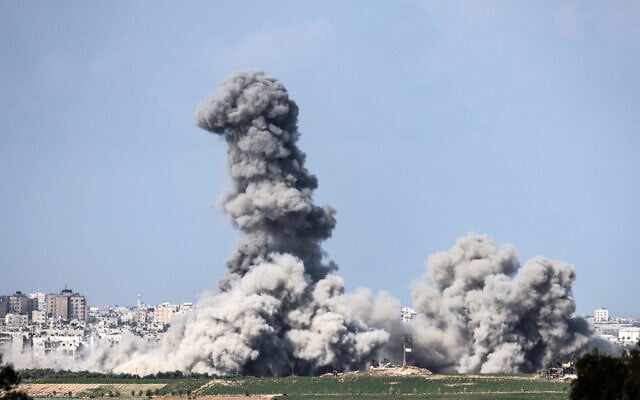 A picture taken from the southern Israeli city of Sderot on October 20, 2023, shows smoke ascending over the northern Gaza Strip following an Israeli strike, amid the ongoing battles between Israel and the Palestinian terror group Hamas. (Photo by Jack Guez / AFP)