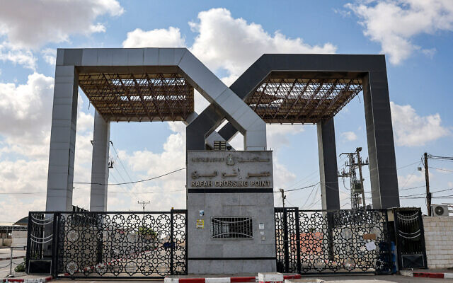 This picture taken on October 19, 2023 shows the closed gate to the Rafah border crossing with Egypt, in the southern Gaza Strip. (Mohammed Abed/AFP) This picture taken on October 19, 2023 shows the closed gate to the Rafah border crossing with Egypt, in the southern Gaza Strip. (Mohammed Abed/AFP)