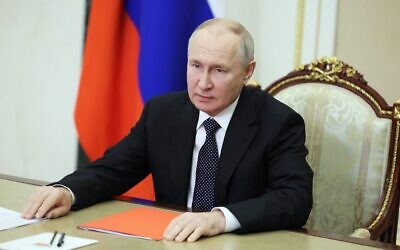 This photograph distributed by Russian state-owned agency Sputnik shows Russia's President Vladimir Putin chairing a Security Council meeting via a video link in Moscow on October 20, 2023. (Gavriil GRIGOROV / POOL / AFP)