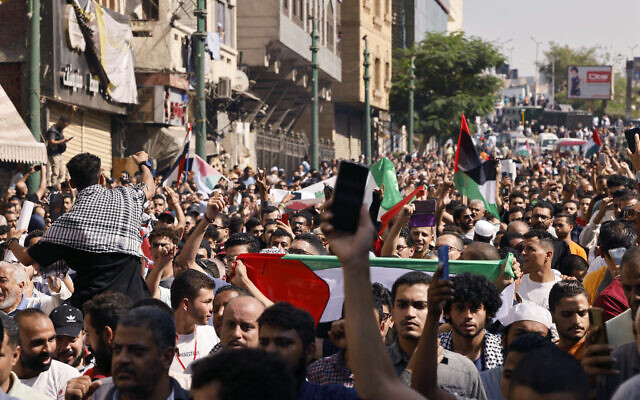 People take to the street during a protest supporting the Palestinian people following Friday Noon prayers outside the al-Azhar Mosque in Cairo on October 20, 2023, amid the ongoing battles between Israel and the Palestinian group Hamas. (Photo by Khaled DESOUKI / AFP) People take to the street during a protest supporting the Palestinian people following Friday Noon prayers outside the al-Azhar Mosque in Cairo on October 20, 2023, amid the ongoing battles between Israel and the Palestinian group Hamas. (Photo by Khaled DESOUKI / AFP)