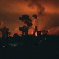This image grab from an AFP TV footage shows fire and smoke rising above Gaza City during an Israeli strike late on October 27, 2023. (Yousef Hassouna/AFP)