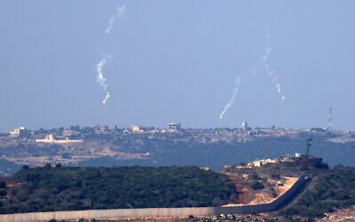 Flares are fired from northern Israel over the southern Lebanese border village of Aita al-Shaab, on October 28,2023.  (Photo by FADEL SENNA / AFP)