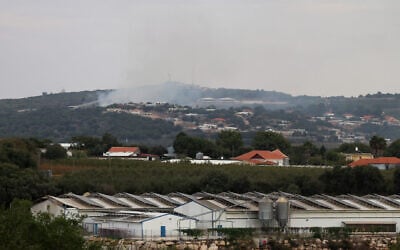 Smoke billows on the Israeli side of the border with Lebanon, due to ongoing border crossfire exchanges between Israel, Hezbollah, and Palestinian terror groups, on October 30, 2023. (AFP)