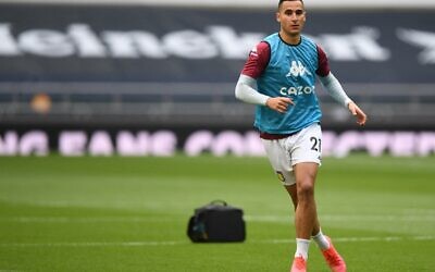 Anwar El Ghazi warms up ahead of a match between Tottenham Hotspur and Aston Villa at Tottenham Hotspur Stadium in London, May 19, 2021. (Daniel LEAL / POOL / AFP)