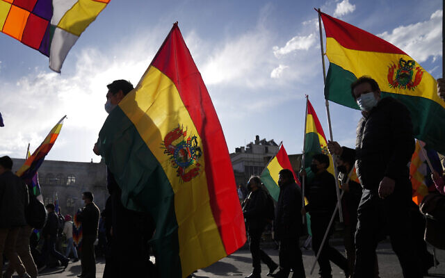 Demonstrators hold Bolivian flags in La Paz, Bolivia, Thursday, Jan. 12, 2023. (AP Photo/Juan Karita) Demonstrators hold Bolivian flags in La Paz, Bolivia, Thursday, Jan. 12, 2023. (AP Photo/Juan Karita)