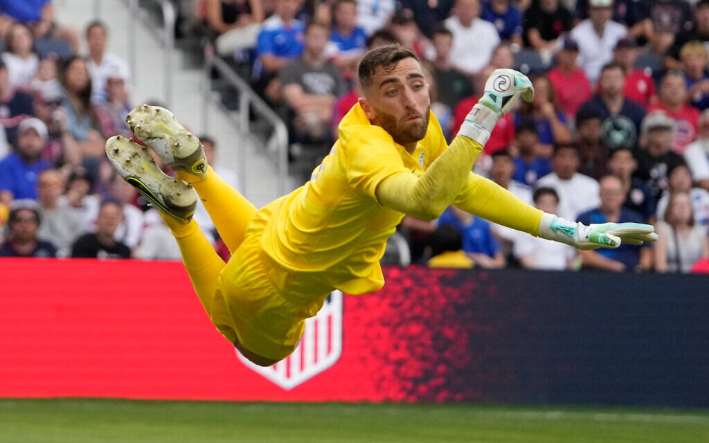 United States goalkeeper Matt Turner leaps for a shot during the first half of an international friendly soccer match against Uzbekistan, September 9, 2023, in St. Louis. (AP Photo/Jeff Roberson)