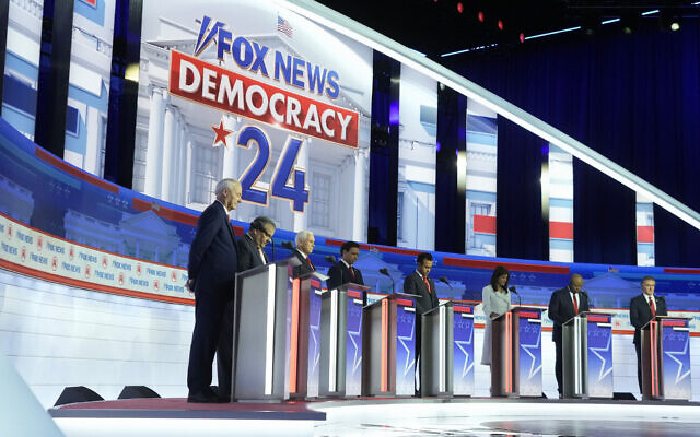 Republican US presidential candidates, from left, former Arkansas Governor Asa Hutchinson, former New Jersey Governor Chris Christie, former vice president Mike Pence, Florida Governor Ron DeSantis, businessman Vivek Ramaswamy, former UN Ambassador Nikki Haley, Senator Tim Scott and North Dakota Governor Doug Burgum stand on stage before a Republican presidential primary debate hosted by Fox News Channel, August 23, 2023, in Milwaukee. (AP Photo/Morry Gash) Republican US presidential candidates, from left, former Arkansas Governor Asa Hutchinson, former New Jersey Governor Chris Christie, former vice president Mike Pence, Florida Governor Ron DeSantis, businessman Vivek Ramaswamy, former UN Ambassador Nikki Haley, Senator Tim Scott and North Dakota Governor Doug Burgum stand on stage before a Republican presidential primary debate hosted by Fox News Channel, August 23, 2023, in Milwaukee. (AP Photo/Morry Gash)
