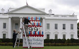 Workers work on a wooden cake display on the North Lawn of the White House, Saturday, September 30, 2023, in honor of former President Jimmy Carter's 99th birthday this weekend. (AP Photo/Manuel Balce Ceneta)
