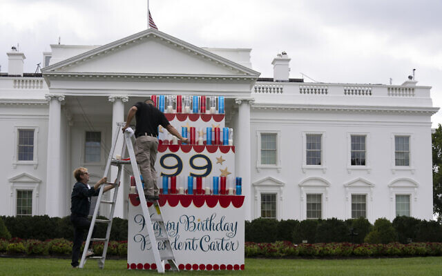 Workers work on a wooden cake display on the North Lawn of the White House, Saturday, September 30, 2023, in honor of former President Jimmy Carter's 99th birthday this weekend. (AP Photo/Manuel Balce Ceneta) Workers work on a wooden cake display on the North Lawn of the White House, Saturday, September 30, 2023, in honor of former President Jimmy Carter's 99th birthday this weekend. (AP Photo/Manuel Balce Ceneta)