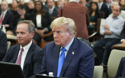 Former US president Donald Trump, right, sits in the courtroom at New York Supreme Court, October 2, 2023, in New York. (AP/Seth Wenig, Pool)
