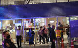 Visitors evacuate from a shopping mall in Bangkok, Thailand, Tuesday, October 3, 2023. (AP Photo/Sakchai Lalit)