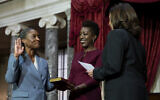 Vice President Kamala Harris, right, swears in Laphonza Butler, left, to the Senate to succeed the late Democratic senator Dianne Feinstein of California, during a re-enactment of the swearing-in ceremony on October 3, 2023, on Capitol Hill in Washington. (AP Photo/Stephanie Scarbrough)