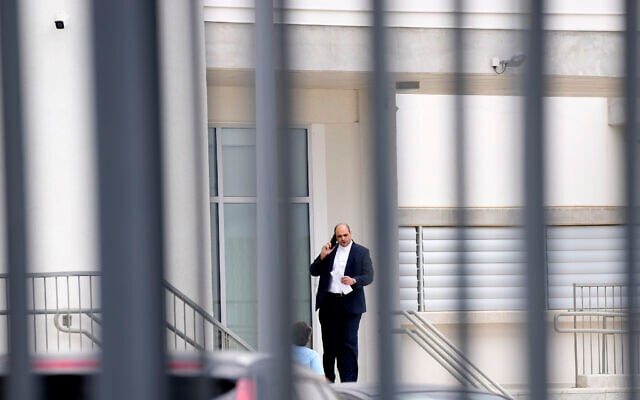 Yiannis Habaris, the lawyer for three of five Israelis who are accused of raping a British woman, speaks on his cellphone outside the Famagusta District Courthouse in Paralimni, Cyprus, on September 12, 2023. (Petros Karadjias/AP) Yiannis Habaris, the lawyer for three of five Israelis who are accused of raping a British woman, speaks on his cellphone outside the Famagusta District Courthouse in Paralimni, Cyprus, on September 12, 2023. (Petros Karadjias/AP)