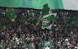 Maccabi fans cheer before a UEFA Europe League match between Panathinaikos and Maccabi Haifa in Haifa, October 5, 2023. (AP Photo/Ohad Zwigenberg)