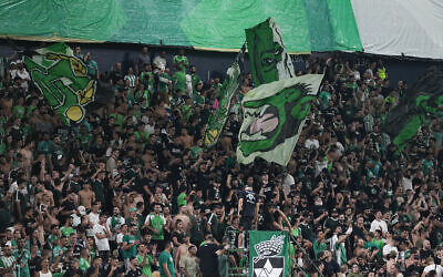 Maccabi fans cheer before a UEFA Europe League match between Panathinaikos and Maccabi Haifa in Haifa, October 5, 2023. (AP Photo/Ohad Zwigenberg)