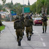 Illustrative: Israeli soldiers deploy in Sderot, Israel, during the Hamas-led onslaught of October 7, 2023. (AP Photo/Ohad Zwigenberg)