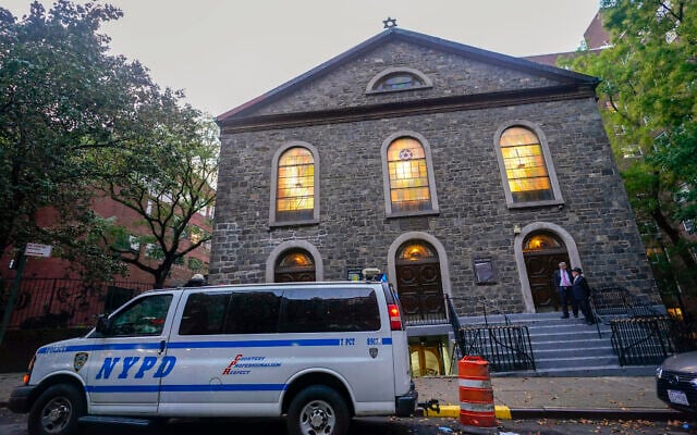 An NYPD patrol car is parked outside a synagogue on the Lower East Side of Manhattan, October 7, 2023. (Mary Altaffer/AP) An NYPD patrol car is parked outside a synagogue on the Lower East Side of Manhattan, October 7, 2023. (Mary Altaffer/AP)
