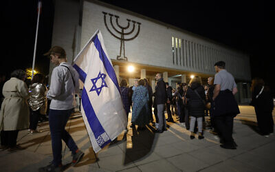 Members of the Jewish community larrive at the synagogue, October 9, 2023 in Strasbourg, eastern France, two days after Hamas fighters launched an unprecedented, multi-front attack on Israel which killed more than 1,000 people. (AP Photo/Jean-Francois Badias)