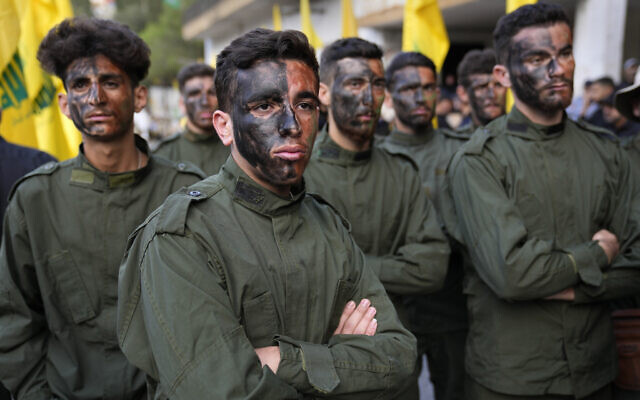Hezbollah fighters attend the funeral procession of their two comrades who were killed by Israeli shelling, in Kherbet Selem village, south Lebanon, Tuesday, Oct. 10, 2023. (AP Photo/Hussein Malla) Hezbollah fighters attend the funeral procession of their two comrades who were killed by Israeli shelling, in Kherbet Selem village, south Lebanon, Tuesday, Oct. 10, 2023. (AP Photo/Hussein Malla)