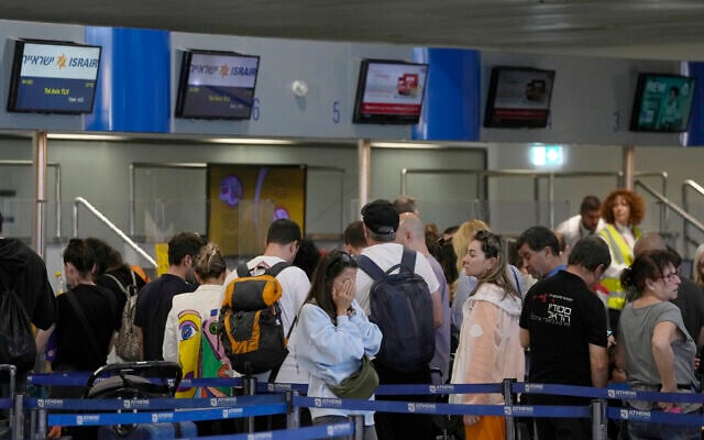 Passengers wait in a line to enter a flight to Israel, at the Eleftherios Venizelos International Airport in Athens, Greece, October 10, 2023. (AP Photo/Thanassis Stavrakis) Passengers wait in a line to enter a flight to Israel, at the Eleftherios Venizelos International Airport in Athens, Greece, October 10, 2023. (AP Photo/Thanassis Stavrakis)