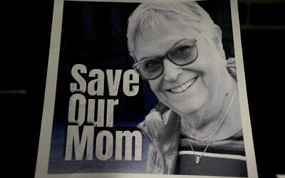 A poster of Ada Sagi, 75-year-old mother of Noam Sagi, is on display at a press conference of British children of Israeli hostages at a hotel in London, October 12, 2023. Noam Sagi, 53, is a London-based psychotherapist who grew up on Kibbutz Nir Oz. His 75-year-old mother, Ada Sagi, was taken hostage on October 7. Sharon Lifschitz, 52, is an artist and academic whose parents are peace activists aged 85 and 83 and were taken hostage too. (AP Photo/Kirsty Wigglesworth)