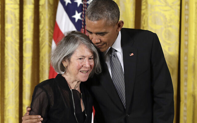 Then-president Barack Obama embraces poet Louise Gluck before awarding her the 2015 National Humanities Medal during a ceremony in the East Room of the White House in Washington on September 22, 2016. (AP Photo/Carolyn Kaster, File) Then-president Barack Obama embraces poet Louise Gluck before awarding her the 2015 National Humanities Medal during a ceremony in the East Room of the White House in Washington on September 22, 2016. (AP Photo/Carolyn Kaster, File)