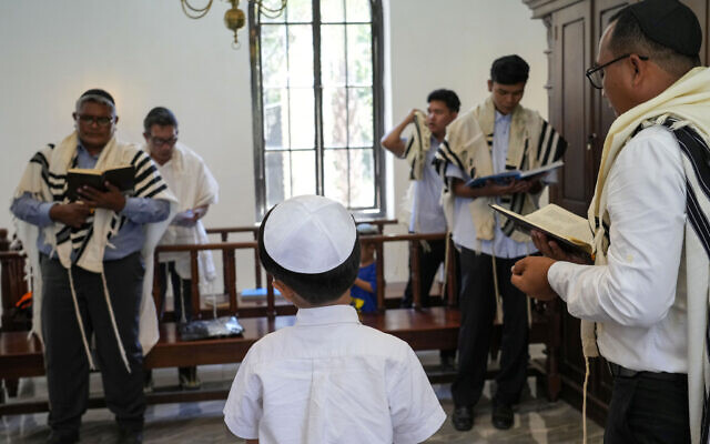 Indonesian Jews pray at Shaar Hashamayim Synagogue in Tondano, North Sulawesi, Indonesia, Saturday, Oct. 14, 2023. (AP Photo/Tatan Syuflana)