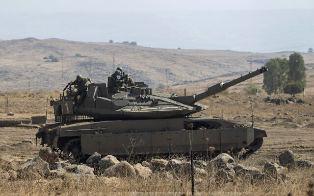 Israeli soldiers stand on a stationed tank near the border with Israel, in Lebanon, Oct. 14, 2023. (AP Photo/Petros Giannakouris) Israeli soldiers stand on a stationed tank near the border with Israel, in Lebanon, Oct. 14, 2023. (AP Photo/Petros Giannakouris)