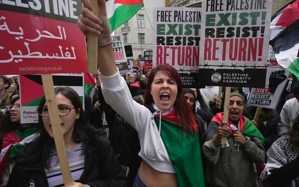 Protesters attend a pro Palestinian demonstration in London, October 14, 2023. (AP Photo/Kin Cheung)