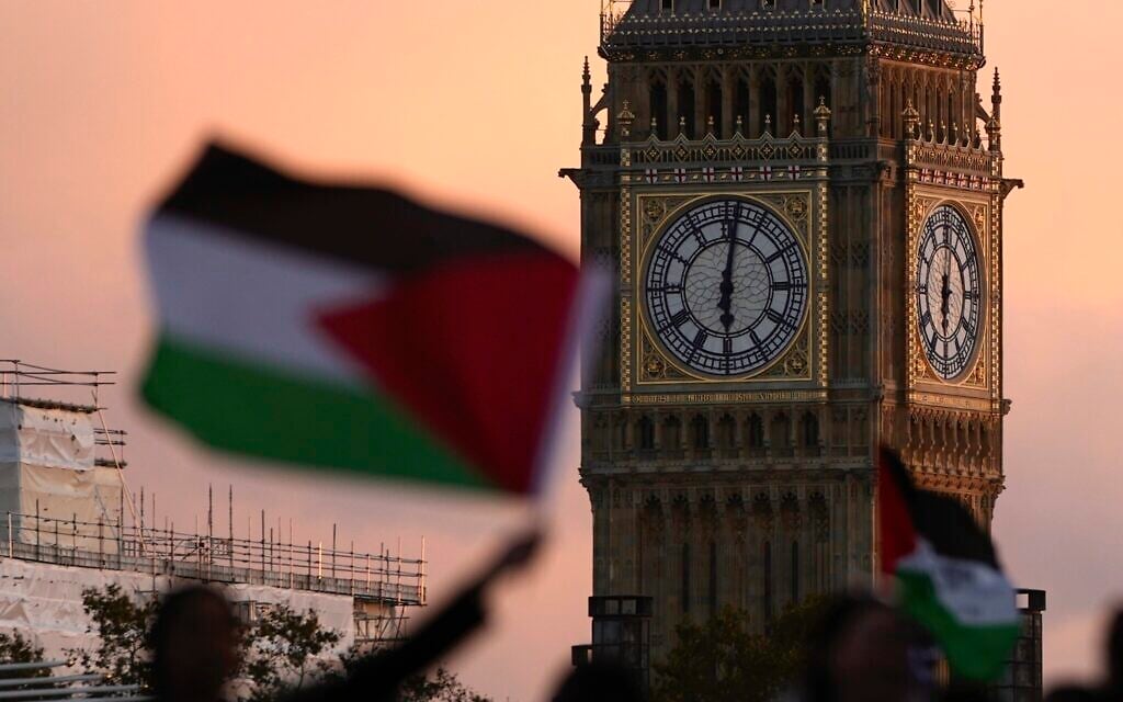 Protesters wave flags as they attend a pro Palestinian demonstration in London, October 14, 2023, in support of Palestinians caught up in the war between Israel and Hamas. (AP Photo/Kin Cheung)