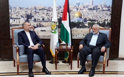 Iran's Foreign Minister Hossein Amirabdollahian, left, meets with Hamas leader Ismail Haniyeh in Doha, Qatar, Oct. 14, 2023. (Iranian Foreign Ministry via AP)