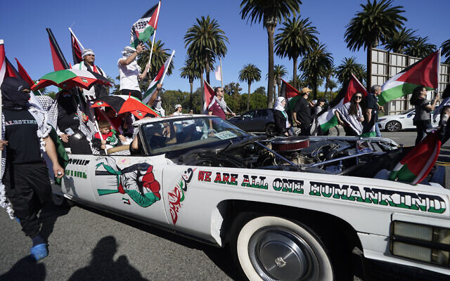 Demonstrators ride a vehicle during a pro-Palestinian protest Saturday, Oct. 14, 2023, in Los Angeles. (AP Photo/Damian Dovarganes) Demonstrators ride a vehicle during a pro-Palestinian protest Saturday, Oct. 14, 2023, in Los Angeles. (AP Photo/Damian Dovarganes)