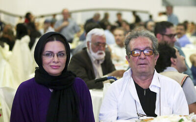 Iranian film director Dariush Mehrjui and his wife Vahideh Mohammadifar attend a film directors' meeting in Tehran, Iran, July 7, 2015. (Abdolvahed Mirzazadeh, ISNA via AP)