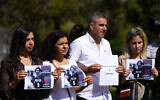 Lebanese journalists hold portraits of Reuters videographer Issam Abdallah, who was killed by shelling on the Lebanon border, during a protest in front of the United Nations headquarters in Beirut, Lebanon, Sunday, October 15, 2023. (AP Photo/Hassan Ammar)