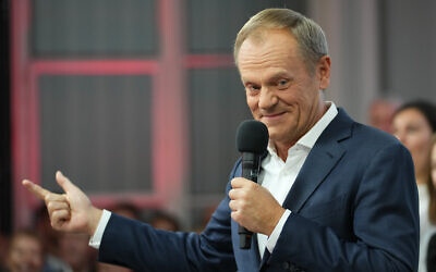 Polish Prime Minister Donald Tusk addresses supporters at his party headquarters in Warsaw, Poland, October 15, 2023. (AP Photo/Petr David Josek)