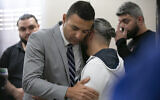 Ahmed Rehab, left, executive director of the Chicago chapter of the Council on American-Islamic Relations, embraces Odey Al-Fayoume, father of Wadea Al-Fayoume, 6, at a news conference at the Muslim Community Center on Chicago's Northwest Side, October 15, 2023. (Jim Vondruska/ Chicago Sun-Times via AP)