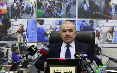 Palestinian Authority Prime Minister Mohammad Shtayyeh attends a cabinet meeting in the West Bank city of Ramallah, October 16, 2023. (Jaafar Ashtiyeh/Pool Photo via AP)