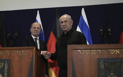 German Chancellor Olaf Scholz, left, shakes hands with Israeli Prime Minister Benjamin Netanyahu, during a press conference in Tel Aviv, Oct. 17, 2023. (AP Photo/Maya Alleruzzo, Pool)
