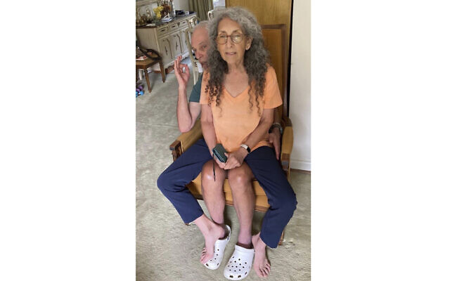 In this undated, unknown location photo released by Iris Weinstein Haggai, Judih Weinstein sits with Gad Haggai as they pose for a photo. (Iris Weinstein Haggai via AP)