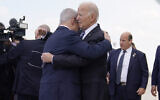 US President Joe Biden (right) is greeted by Prime Minister Benjamin Netanyahu after arriving at Ben Gurion International Airport, October 18, 2023, in Lod. (AP Photo/Evan Vucci)