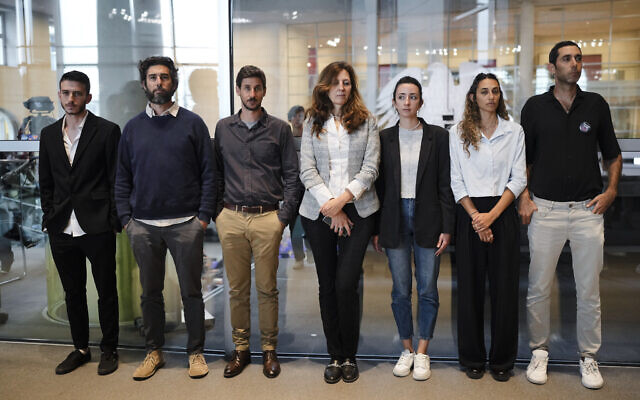 From left: Adi Zalesky, Asaf Gorelik, Liron Lavi, Ricarda Louk, Adi Louk, Roni Romann and Gili Rimann, relatives of people held hostage by Hamas, pose for a group photo after they listen to the speech German Chancellor Olaf Scholz at the parliament Bundestag in Berlin, Germany, Thursday, Oct. 19, 2023. (AP Photo/Markus Schreiber) From left: Adi Zalesky, Asaf Gorelik, Liron Lavi, Ricarda Louk, Adi Louk, Roni Romann and Gili Rimann, relatives of people held hostage by Hamas, pose for a group photo after they listen to the speech German Chancellor Olaf Scholz at the parliament Bundestag in Berlin, Germany, Thursday, Oct. 19, 2023. (AP Photo/Markus Schreiber)
