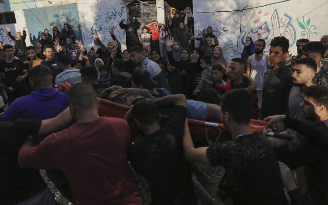 Palestinian women react as a body is carried out from the rubble of a destroyed house following Israeli airstrikes on Gaza City, Saturday, Oct. 21, 2023. (AP Photo/Abed Khaled) Palestinian women react as a body is carried out from the rubble of a destroyed house following Israeli airstrikes on Gaza City, Saturday, Oct. 21, 2023. (AP Photo/Abed Khaled)