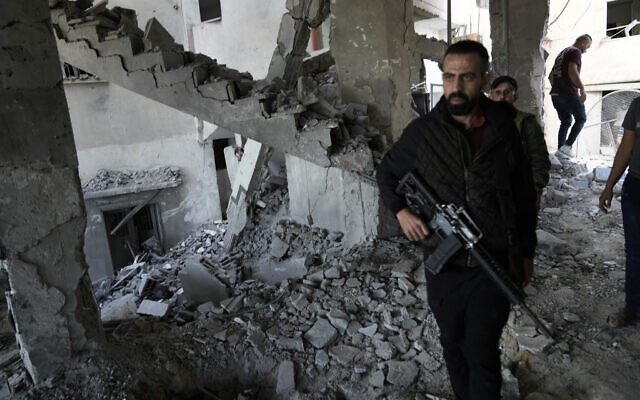 Palestinians inspect the damage after an Israeli strike hit a compound beneath a mosque in Jenin refugee camp, West Bank, Sunday, Oct. 22, 2023.  (AP Photo/Majdi Mohammed)