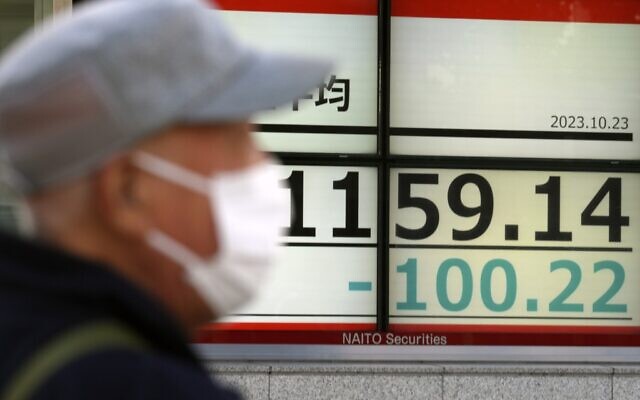 A person stands in front of an electronic stock board showing Japan's Nikkei 225 index at a securities firm Oct. 23, 2023, in Tokyo. (AP Photo/Eugene Hoshiko) A person stands in front of an electronic stock board showing Japan's Nikkei 225 index at a securities firm Oct. 23, 2023, in Tokyo. (AP Photo/Eugene Hoshiko)