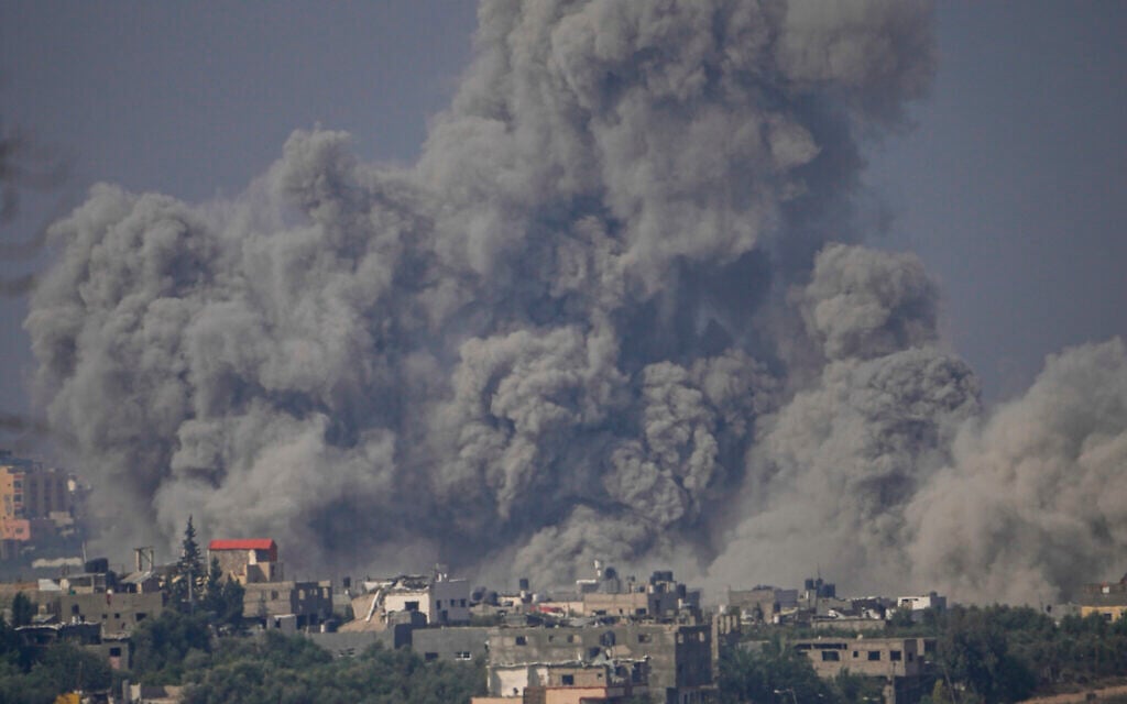 Smoke rises following an Israeli airstrike in the Gaza Strip, as seen from southern Israel, October 23, 2023. (AP Photo/ Ariel Schalit)