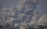 Smoke rises following an Israeli airstrike in the Gaza Strip, as seen from southern Israel, October 23, 2023. (AP Photo/ Ariel Schalit)