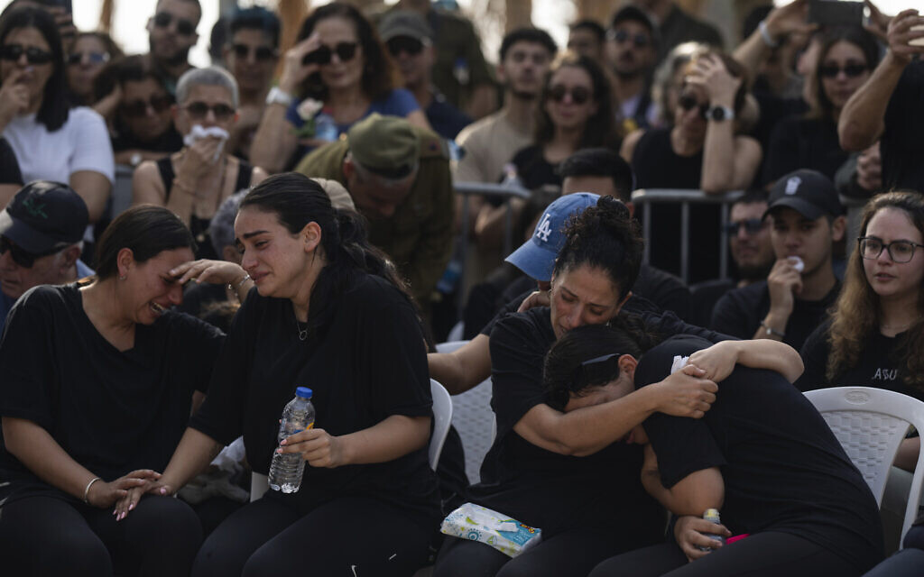 Mourners attend the funeral of Erik Kraunik, the chief of security of Kibbutz Be'eri, at Yehud cemetery, central Israel, Monday, Oct. 23, 2023. (AP/Petros Giannakouris)