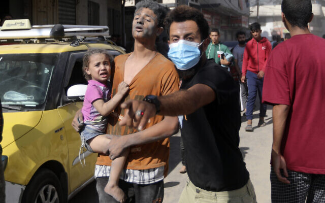 Injured Palestinians are evacuated following Israeli airstrikes on town of Khan Younis, southern Gaza Strip, Thursday, Oct. 26, 2023. (AP Photo/Mohammed Dahman) Injured Palestinians are evacuated following Israeli airstrikes on town of Khan Younis, southern Gaza Strip, Thursday, Oct. 26, 2023. (AP Photo/Mohammed Dahman)