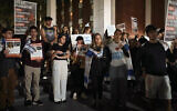 Jewish Rutgers University's students and members of the community gather holding placards and flags to hold solidarity and vigil for Israel on Wednesday, Oct. 25, 2023, in New Brunswick, N.J. (AP Photo/Andres Kudacki)